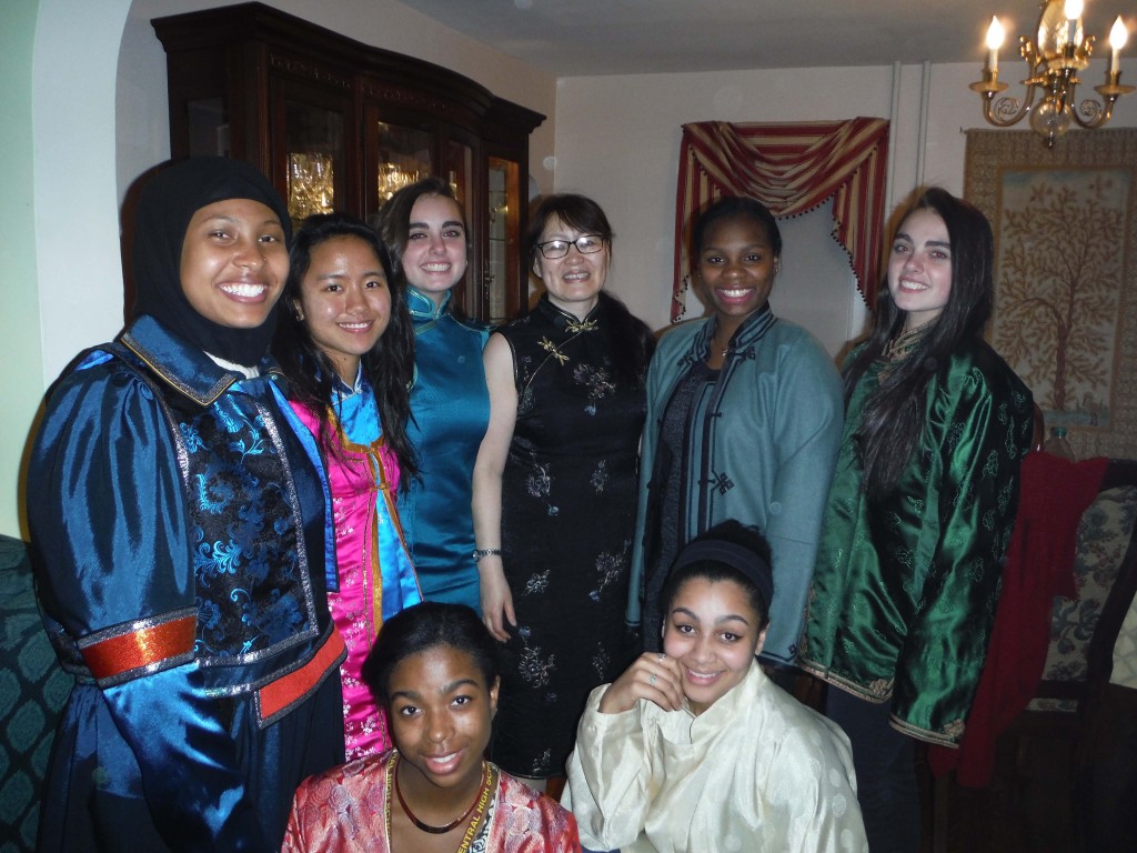 Munhtuya Goulden (in glasses) and the WINS girls celebrate Mongolian New Year in traditional garb. Photo: Betsy Payne