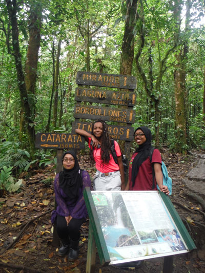 Students in front of trail signage