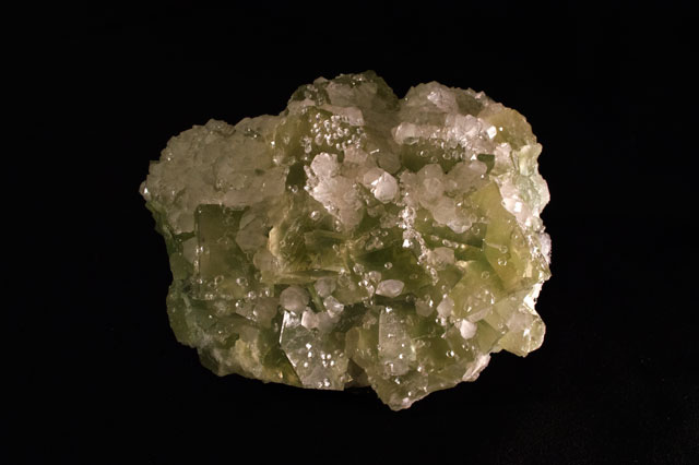 Why do minerals sparkle? A green sparkling mineral from the vault at the Academy of Natural Sciences.