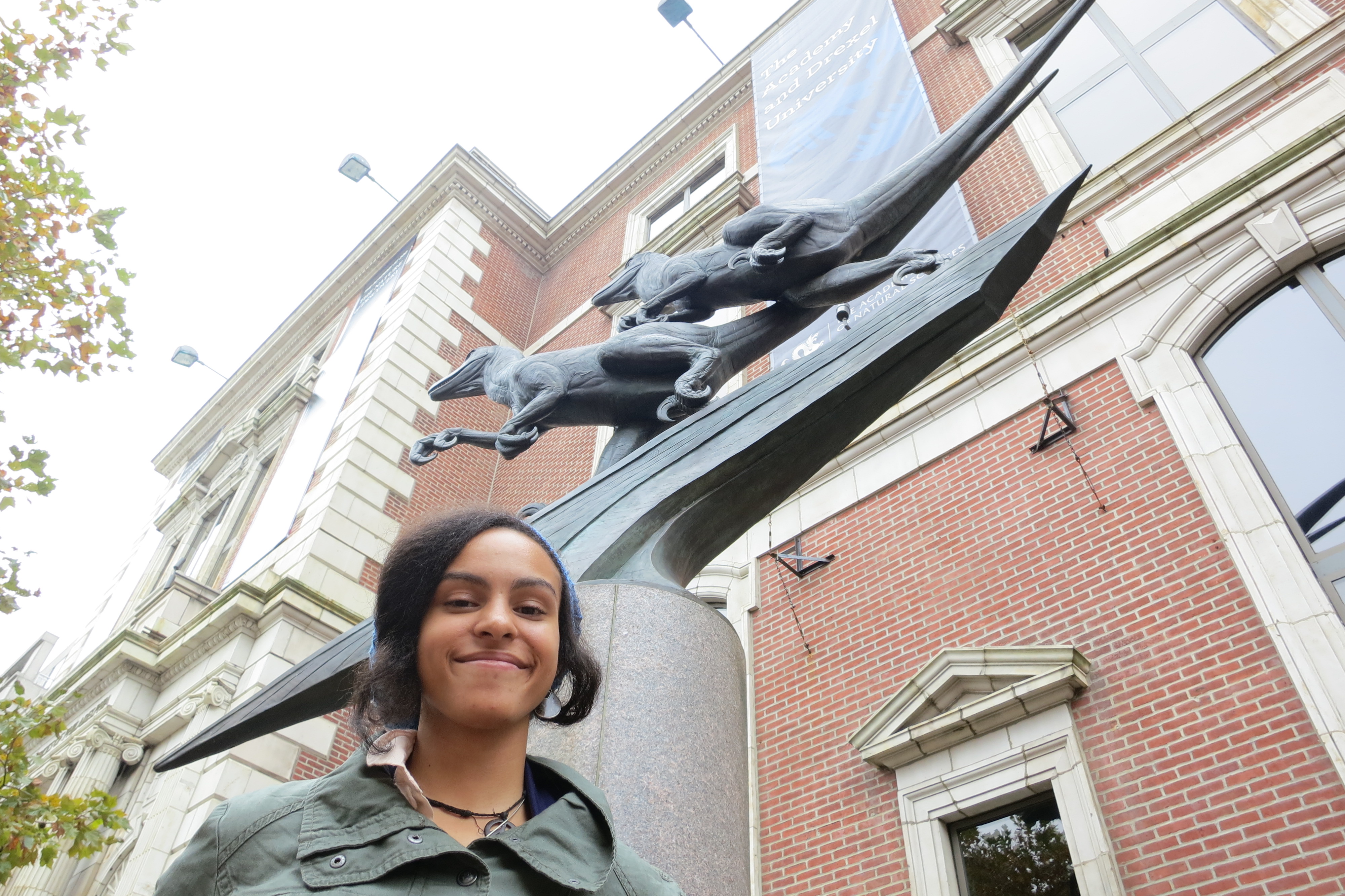 Aja Carter in front of the Academy of Natural Sciences