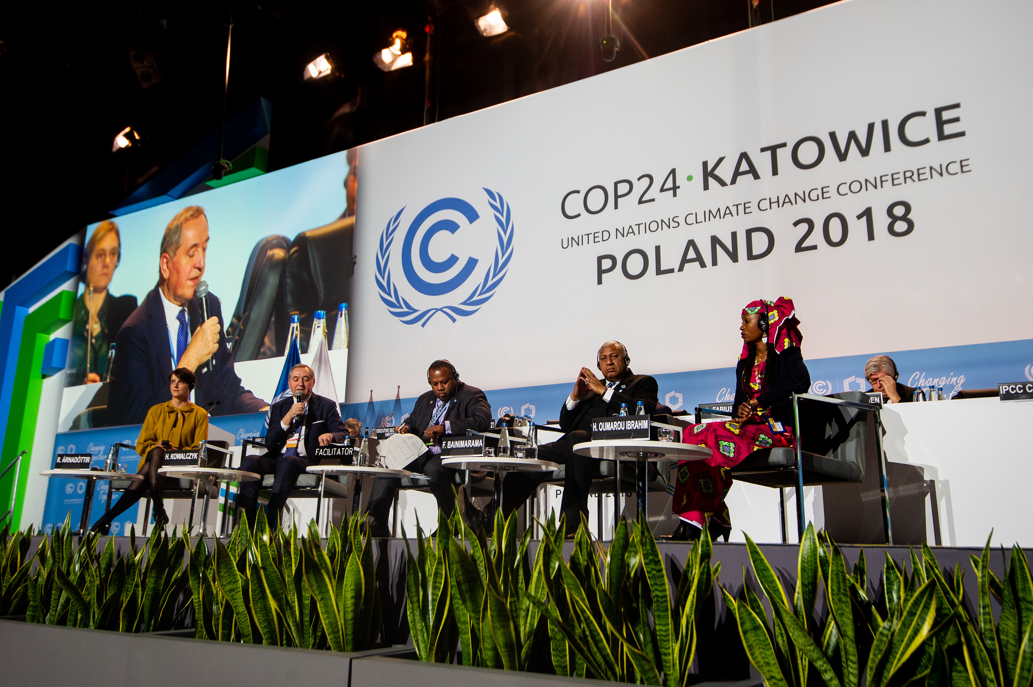 Panel of presenters on stage