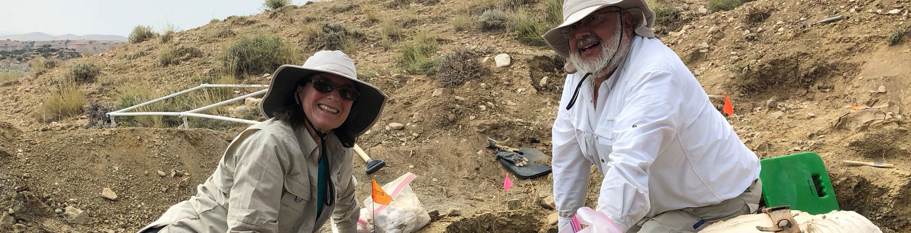 Karen and Wayne lattuca working in dirt in fossil bed surrounded by tools of the trade