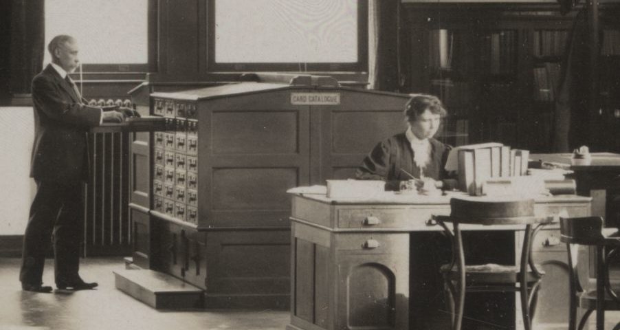 "Mystery Woman" pictured working at desk in black and white photograph