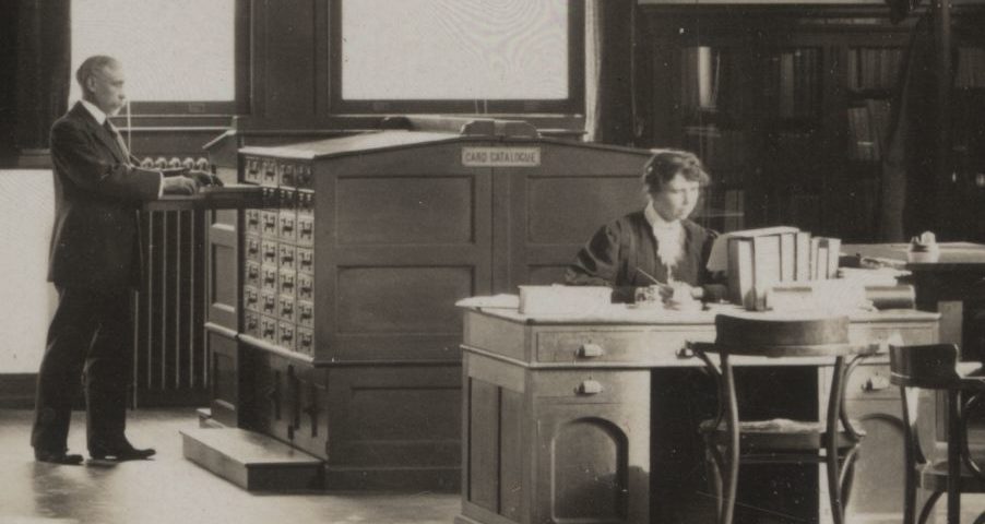 "Mystery Woman" pictured working at desk in black and white photograph