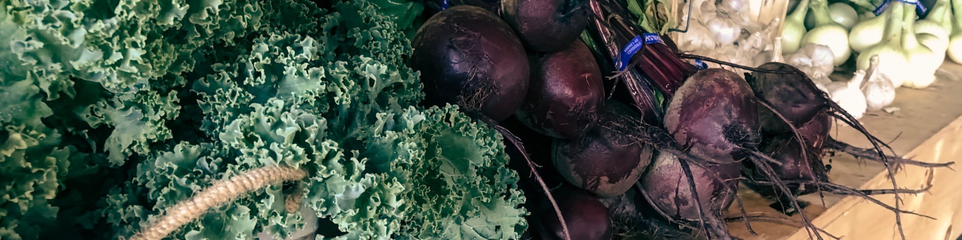 greens in baskets on a table