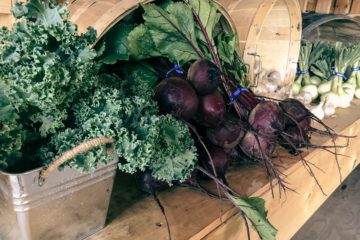 greens in baskets on a table